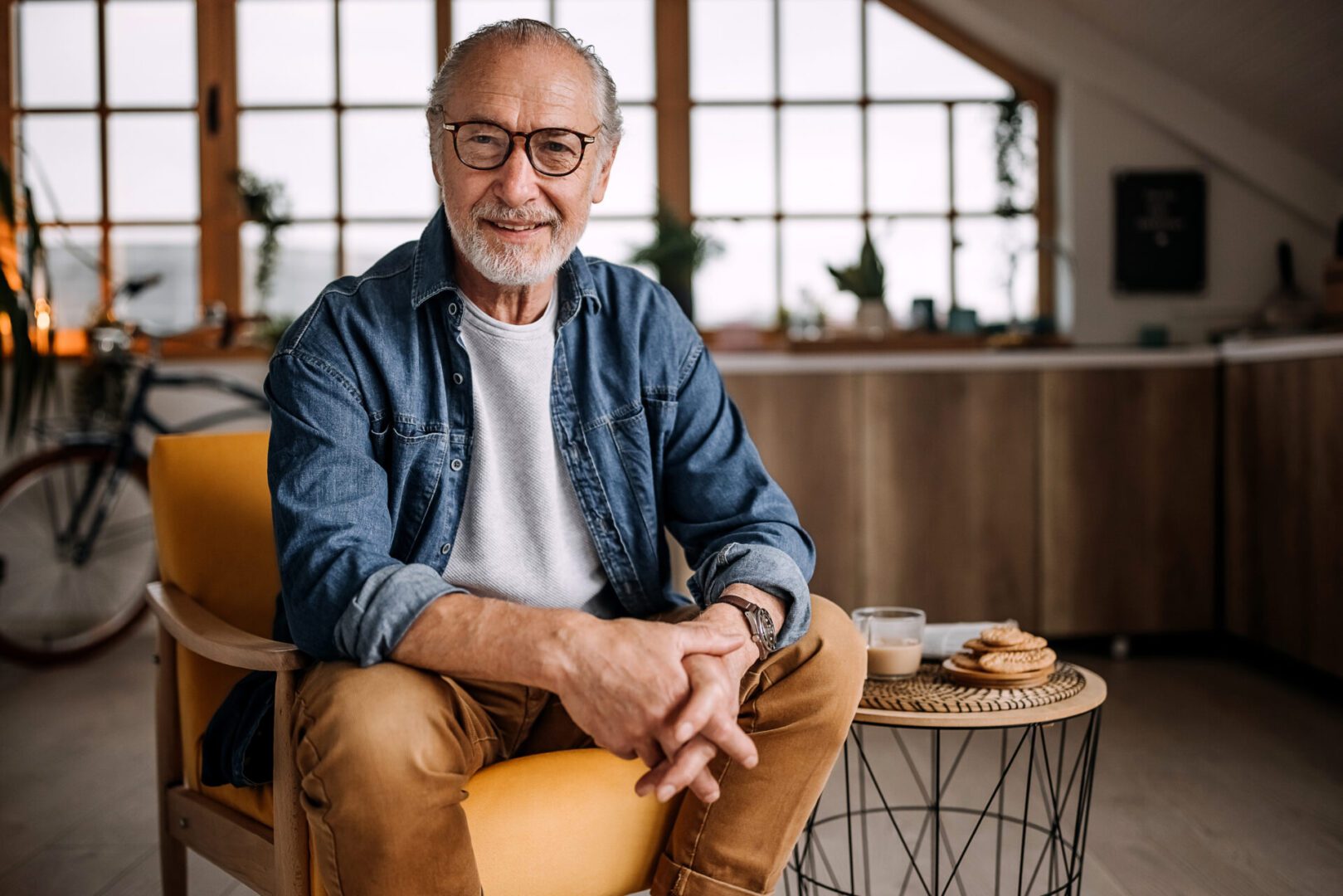 Portrait of senior man sitting in chair